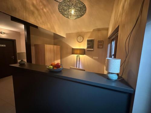 a room with a counter with a bowl of fruit on it at JP Motel Mali Pariz in Bor