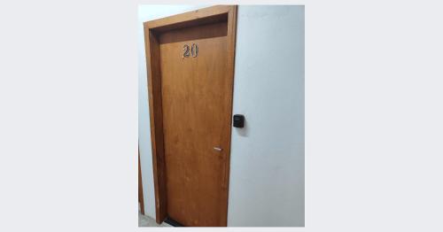 a door in a room with the number twenty on it at Villa Bilac - Amplos Studios 2km da Vila Germânica in Blumenau