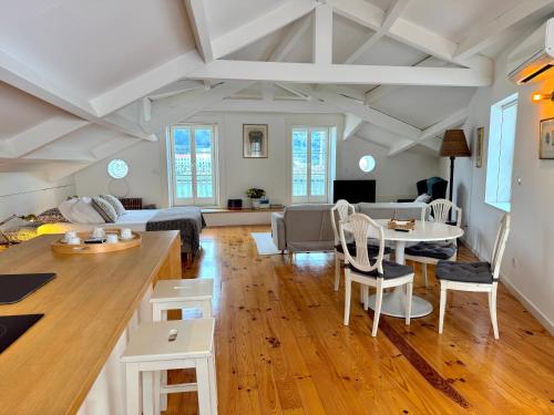a living room with a couch and a table at Douro River Studios in Porto