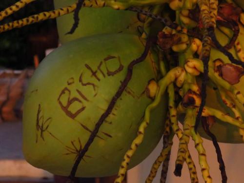 a green melon with the word eaten written on it at Maya Beach Hotel in Maya Beach