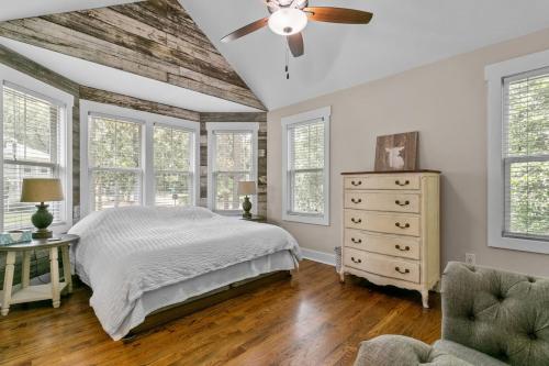 a bedroom with a bed and a ceiling fan at Hunter House Southern Pines in Southern Pines