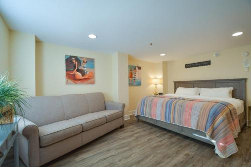 a living room with a bed and a couch at Lakeshore Lodging Lodge 611 in Homer