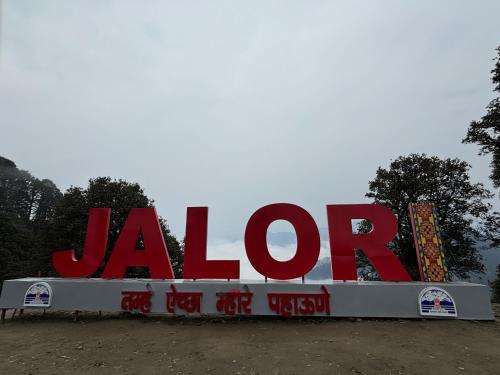 a large sign for a jarl gas station at Mizuki Retreat and Cafe, Tirthan Valley in Gushaini