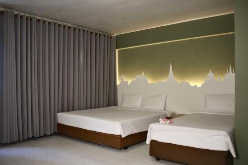 Cama o camas de una habitación en Sun Hotel