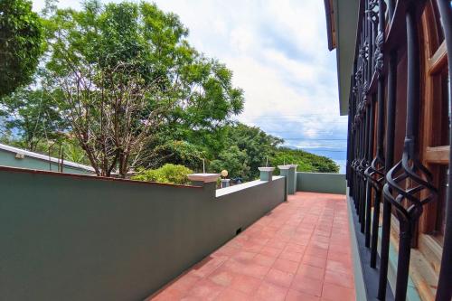 a balcony of a house with a brick walkway at View of Atitlán Private apartment with balcony in Sololá