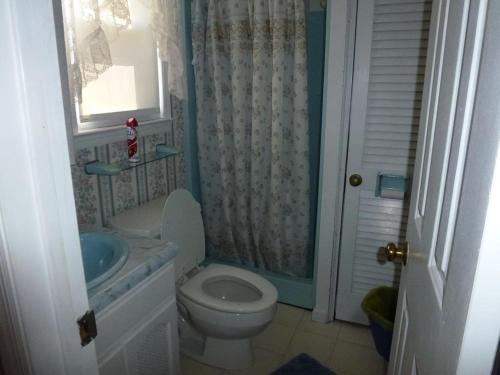 a bathroom with a toilet and a sink at Wi-Fi, Patio, Yard, Balcony, Deck, Ocean Side Duplex 1St Floor In Ship Bottom 10609 in Ship Bottom