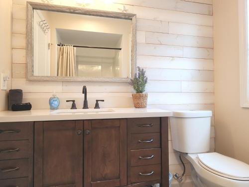 a bathroom with a sink and a toilet at The Sand Star-4BDRM Ventnor Home near Bay & AC in Ventnor City