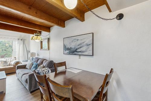 a dining room with a table and a couch at Sugar Shack in Carpinteria