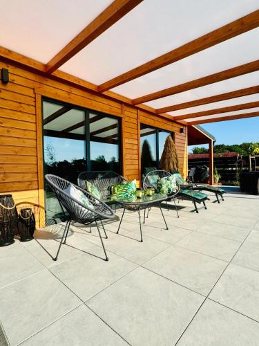 Φωτογραφία από το άλμπουμ του Całoroczny Domek Boho Lubniewice jezioro jacuzzi σε Lubniewice