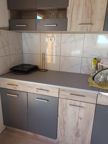 a kitchen with a sink and a counter top at Etno Zvuk Tisine Djukic in Valjevo