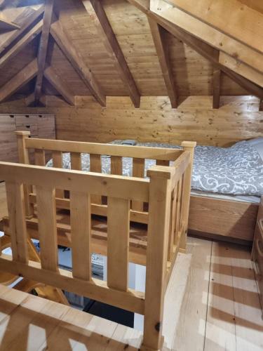 a bedroom with a bunk bed in a cabin at Etno Zvuk Tisine Djukic in Valjevo