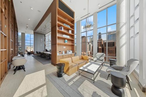 a living room with a couch and chairs in a building at Kasa River North Chicago in Chicago