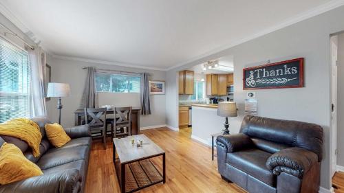 a living room with a couch and a table at Great two bedroom family spot with convenient access to downtown in Denver
