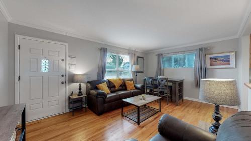 a living room with a couch and a table at Great two bedroom family spot with convenient access to downtown in Denver