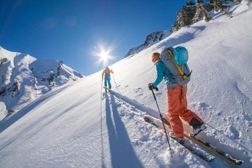 two people on skis on a snow covered mountain at Chalet Les écrins Guillestre Vars Risoul Queyras in Guillestre