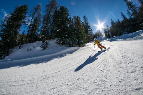 a person is skiing down a snow covered slope at Chalet Les écrins Guillestre Vars Risoul Queyras in Guillestre