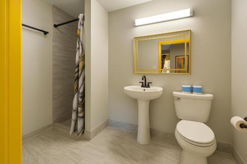 a bathroom with a toilet and a sink at The Mt Vernon Inn in Baltimore