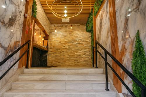 a staircase in a building with a brick wall at The Mt Vernon Inn in Baltimore