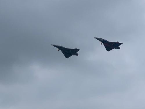 two fighter jets flying in formation in the sky at Chambre avec terrasse in LʼIsle-Jourdain