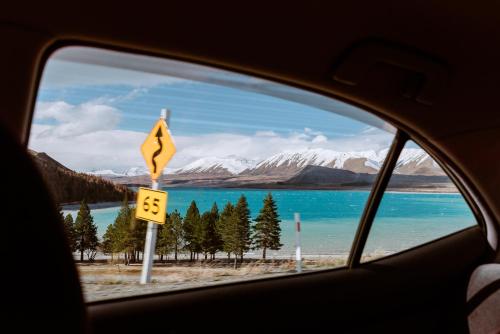 a view of a lake from a car window at Skylark Cabin in Twizel
