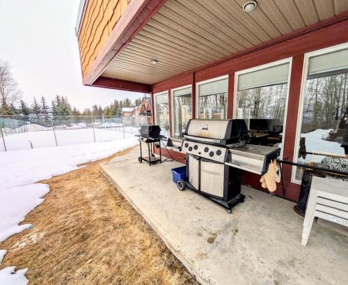 a grill on the side of a house at Purcell Condos by StayIn in Kimberley