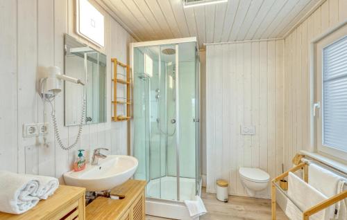 a bathroom with a glass shower and a sink at Beautiful Home In Zerpenschleuse in Zerpenschleuse