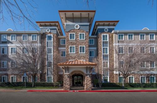 an apartment building with a gazebo in front of it at Staybridge Suites Rocklin - Roseville Area by IHG in Rocklin