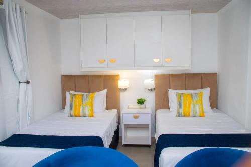 Ένα ή περισσότερα κρεβάτια σε δωμάτιο στο Optimum Stay Self Catering Accommodation - Twin Room 2 Single Beds