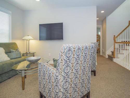 a living room with a couch and a chair and a table at Oceanfront Ocean Views Wifi Beach Badges Decks Spectacular Oceanfront -- With Fantastic Views -- Located In Prestigious Harvey Cedars Just in Harvey Cedars