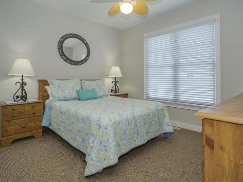 a bedroom with a bed and a mirror and a window at Oceanfront Ocean Views Wifi Beach Badges Decks Spectacular Oceanfront -- With Fantastic Views -- Located In Prestigious Harvey Cedars Just in Harvey Cedars