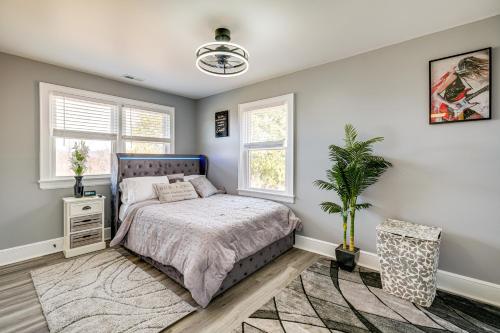 a bedroom with a bed and a potted plant at 5 Mi to Dtwn Family-Friendly Home in Roanoke! in Roanoke
