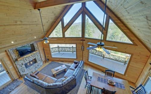 an overhead view of a living room in a log cabin at Majestic View in Mashburn Mill
