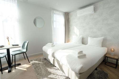 Ein Bett oder Betten in einem Zimmer der Unterkunft Boutique Hotel At Sea