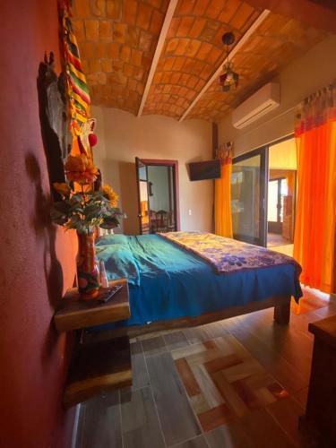 a bedroom with a bed in a room at Hermi Bungalows in La Peñita de Jaltemba