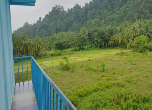 a view of a tennis court from a balcony at ANIBESH HOTEL in Havelock Island