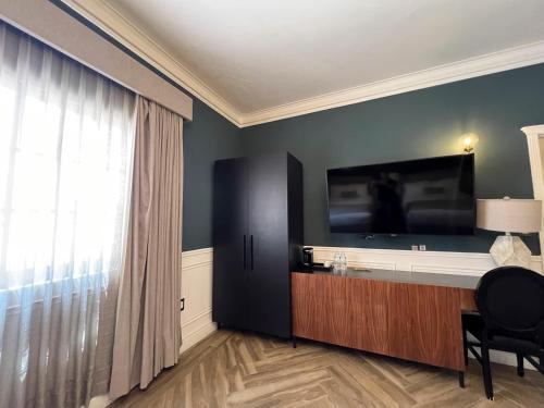 TV a/nebo společenská místnost v ubytování Hotel Mansion E Borbon
