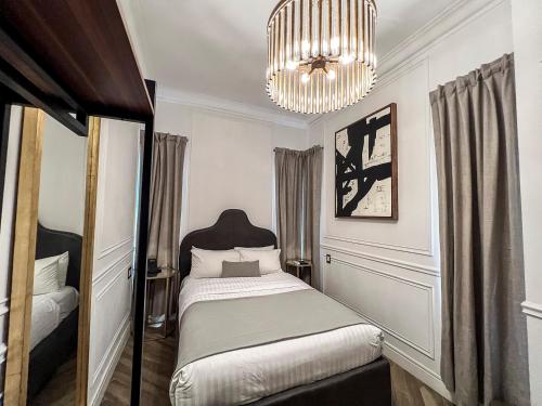 Postel nebo postele na pokoji v ubytování Hotel Mansion E Borbon