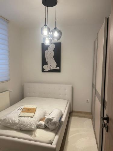 Ένα ή περισσότερα κρεβάτια σε δωμάτιο στο Home-city apartman