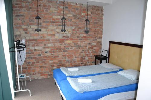 Postel nebo postele na pokoji v ubytování Flores Apartament