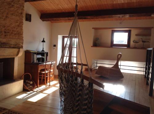 a living room with a hammock in a house at Charming house south Oléron with bikes in Le Château-dʼOléron