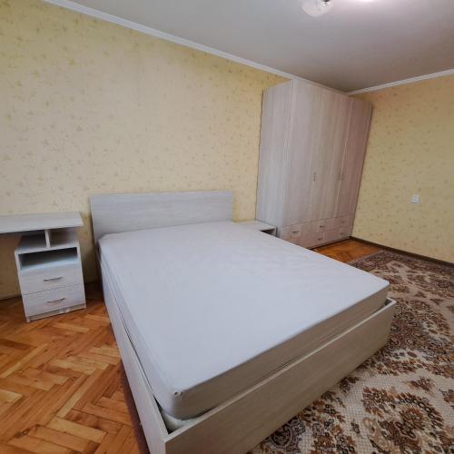เตียงในห้องที่ Bănulescu Bodoni