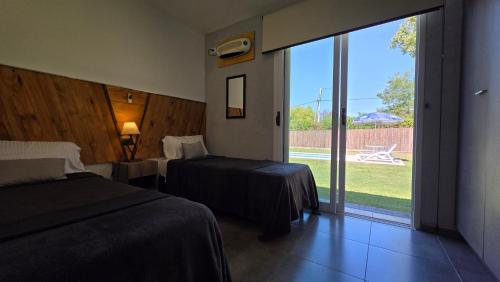 Postel nebo postele na pokoji v ubytování OlivaNegra Resort - Oliva1