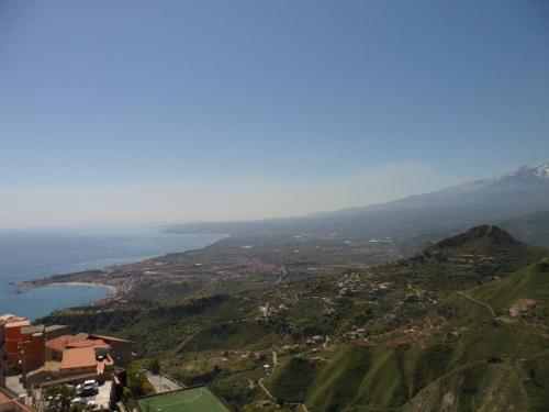 a view of a city and a body of water at Hotel Panorama di Sicilia in Castelmola