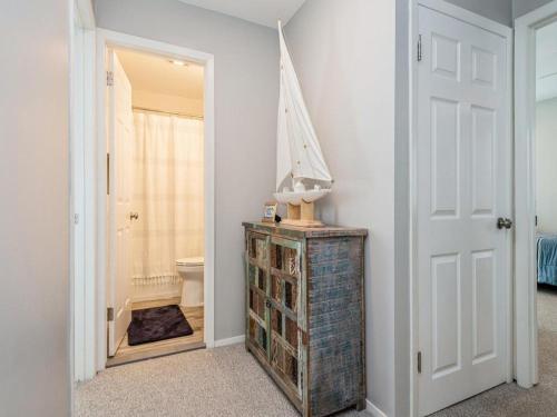 a room with a bathroom with a mirror and a toilet at Beach Badges Wifi Washerdryer Private Yard 14020 in Brant Beach