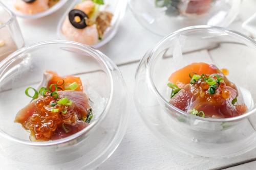 two plastic containers filled with food on a table at Premier Hotel Nakajima Park Sapporo in Sapporo