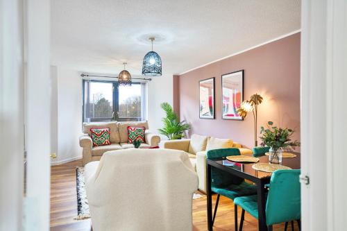 a living room with a couch and a table at 2BR Flat with Free Parking in Central Location in Glasgow