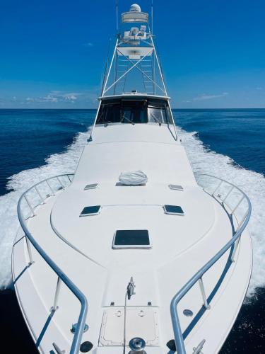 a white boat in the middle of the ocean at Keys Livin - Yacht Rental in Key West