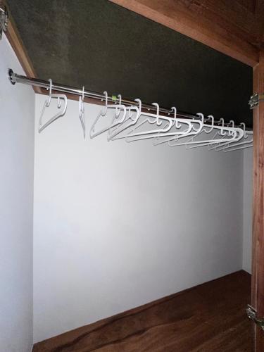 a bunch of metal hooks hanging from a wall at Brand New Beachfront Sunset Apartments in San Felipe de Puerto Plata
