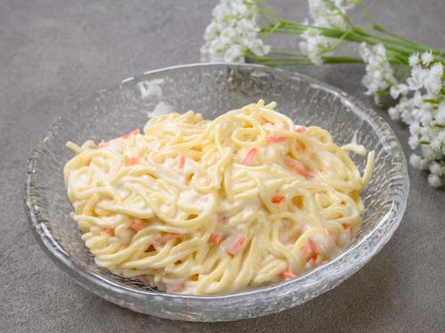 a glass bowl of pasta withiments in it with flowers at Nawa Plaza Hotel in Tokai