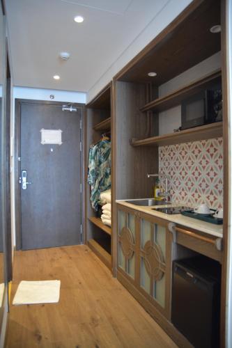 Kuchyň nebo kuchyňský kout v ubytování APEC MŨI NÉ MANDALA